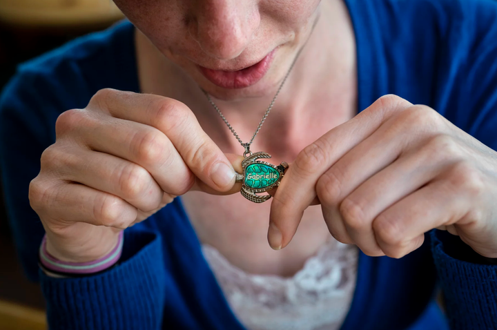 Ellen Kennedy wears a necklace her daughter would have received when she was older. (Sarah Rice, special to ProPublica)