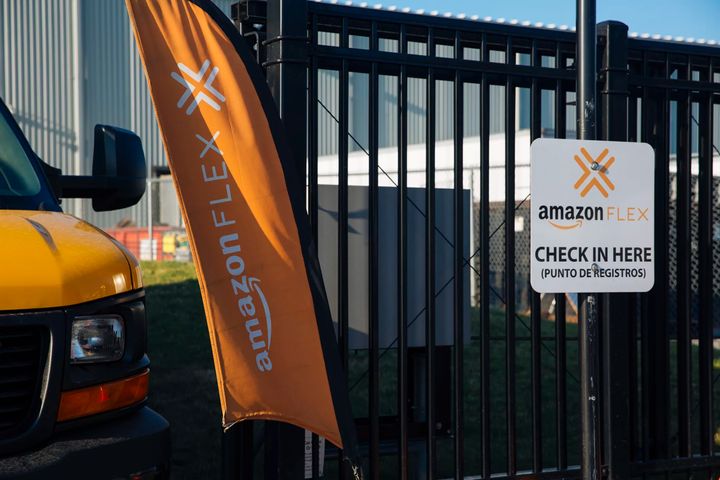 A check-in sign at a Chicago warehouse for Amazon Flex drivers, who sign up for delivery shifts using their own vehicles and 