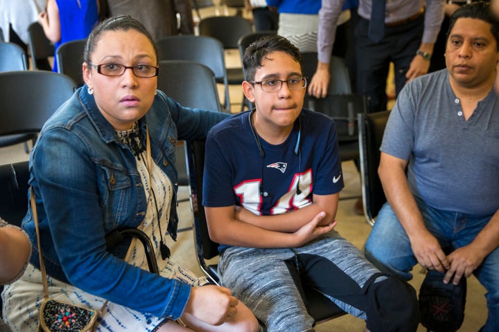 BOSTON, MA - AUGUST 26: Mariela Sanchez of Tegucigalpa, Honduras, left, her son Jonathan Sanchez, 16, and husband Gary Sanche