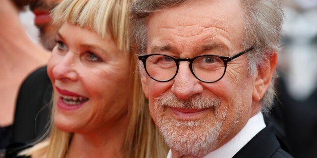 Director Steven Spielberg and his wife Kate Capshaw pose on the red carpet as they arrive for the screening...