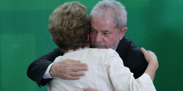 Brazilâs President Dilma Rousseff and former President Luiz Inacio Lula da Silva embrace during his...