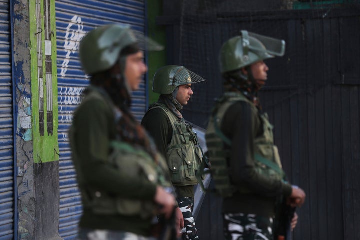 Indian paramilitary soldiers guard at a closed market in Srinagar, Kashmir, Wednesday, Aug. 21, 2019.