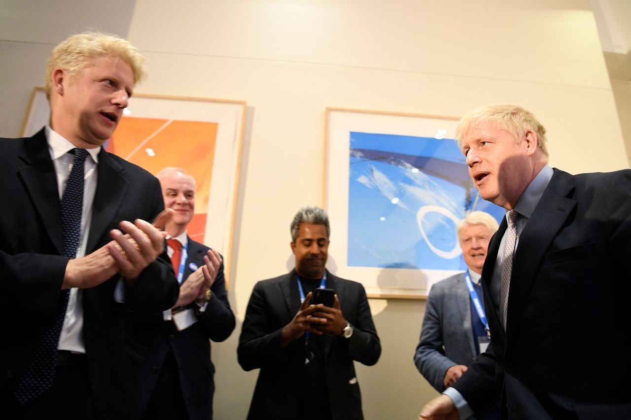 Jo Johnson, left, with the prime minister 