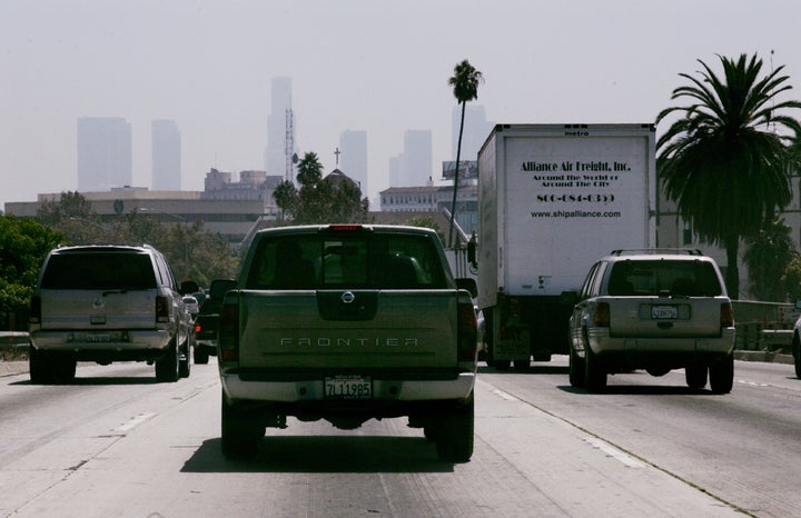 Cars and trucks travel on a freeway in Los Angeles. Advocates of the emissions agreement argue that it would significantly reduce greenhouse gas emissions.