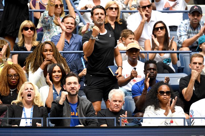 Venus Williams, coach Patrick Mouratoglou, husband Alexis Ohanian, and Meghan, Duchess of Sussex, cheer for Serena Williams.
