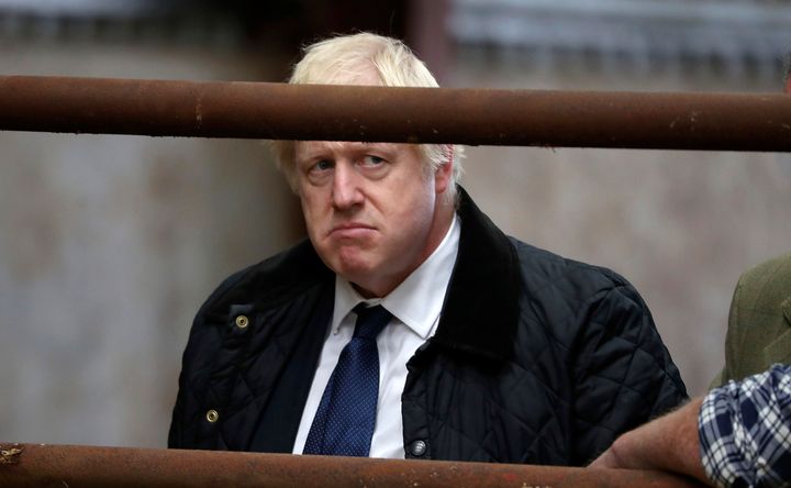 Britain's Prime Minister Boris Johnson visits Darnford Farm in Banchory near Aberdeen, Scotland, Friday Sept. 6, 2019, to coincide with the publication of Lord Bew's review and an announcement of extra funding for Scottish farmers. (Andrew Milligan/PA via AP)