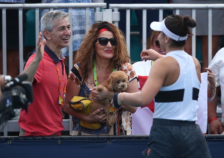 Bianca Andreescu celebrates with her parents after her three set win over Irina-Camelia Begu of Romania during day four of the Miami Open on March 21, 2019.