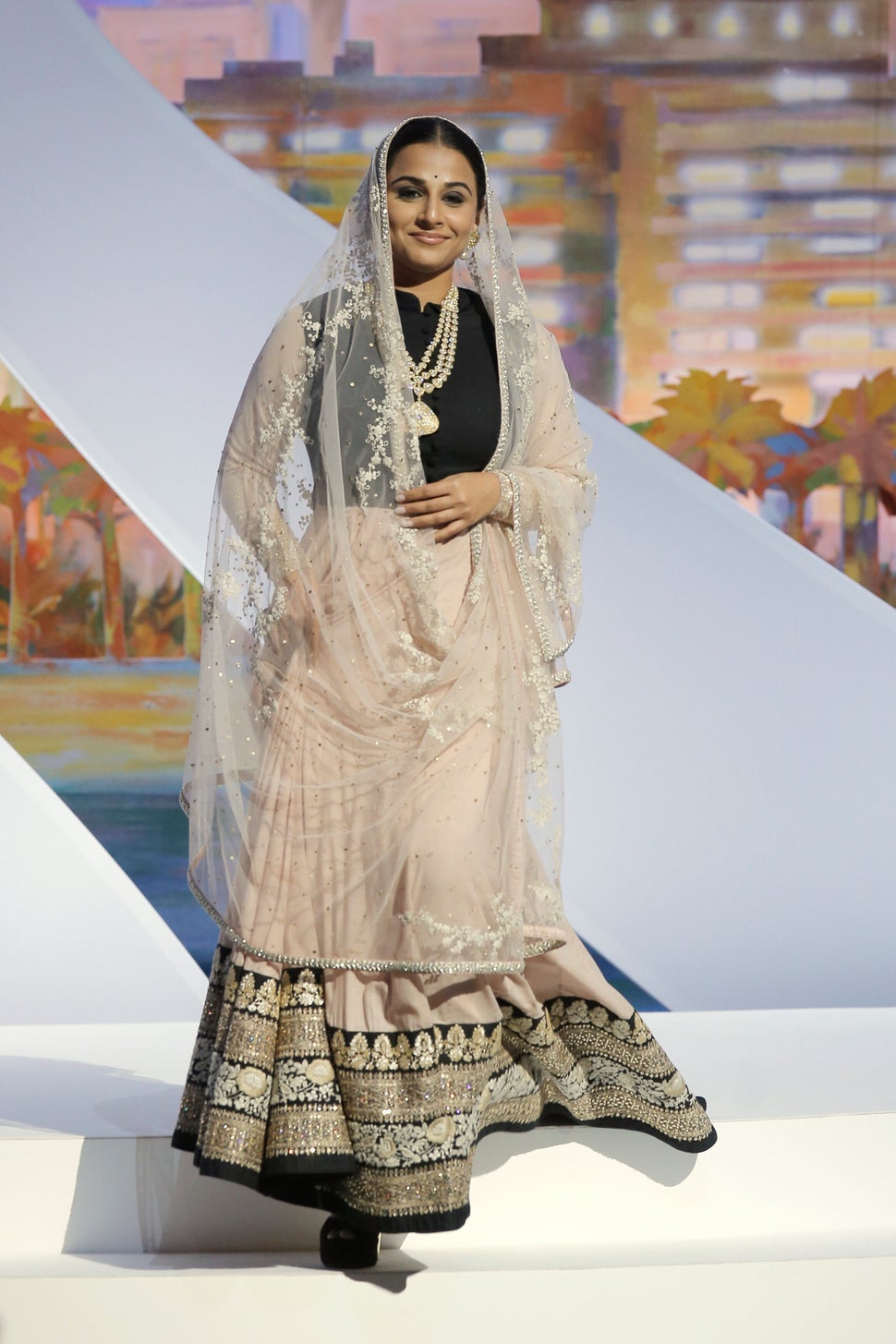 Actress and jury member Vidya Balan acknowledges applause during the opening ceremony ahead of the screening of The Great Gatsby at the 66th international film festival, in Cannes, southern France, Wednesday, May 15, 2013. (AP Photo/Francois Mori)