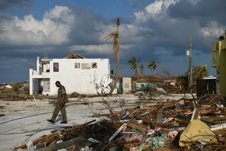 A member of the Bahamian military assesses damage in a destroyed neighborhood in the wake of Hurricane Dorian in Marsh Harbou
