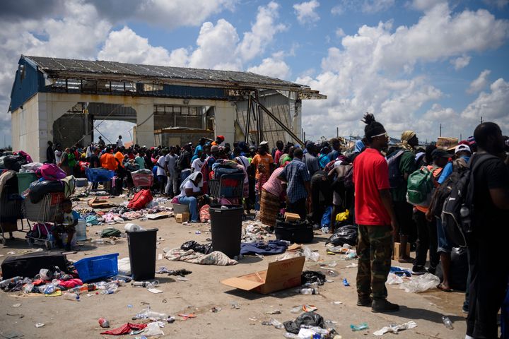 Hundreds of people who were displaced by Hurricane Dorian gather at a port that was turned into a distribution and evacuation center in Marsh Harbour, Bahamas on September 7, 2019. (Carolyn Van Houten/The Washington Post via Getty Images)