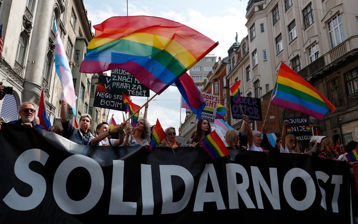 Participants march during the country's first ever LGBT pride parade in downtown Sarajevo, Bosnia-Herzegovina, Sunday, Sept.