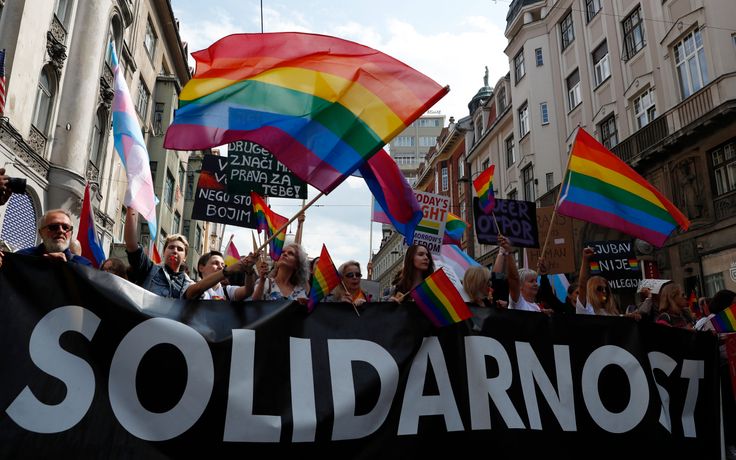 Participants march during the country's first ever LGBT pride parade in downtown Sarajevo, Bosnia-Herzegovina, Sunday, Sept. 8, 2019. Sarajevo is the last capital city in the Balkans to hold a pride parade after neighboring countries moved to improve LGBT rights. (AP Photo/Darko Bandic)