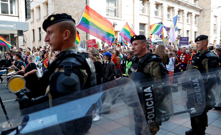 Policemen guard the country's first ever LGBT pride parade in downtown Sarajevo, Bosnia-Herzegovina, Sunday, Sept. 8, 2019. Sarajevo is the last capital city in the Balkans to hold a pride parade after neighboring countries moved to improve LGBT rights. (AP Photo/Darko Bandic)