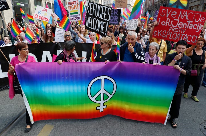 Participants march during the country's first ever LGBT pride parade in downtown Sarajevo, Bosnia-Herzegovina, Sunday, Sept.