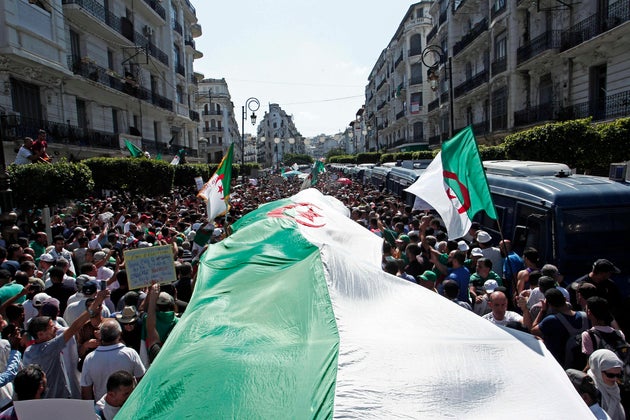 Algerian demonstrators take to the streets in the capital to protest against the government, in Algeria,...