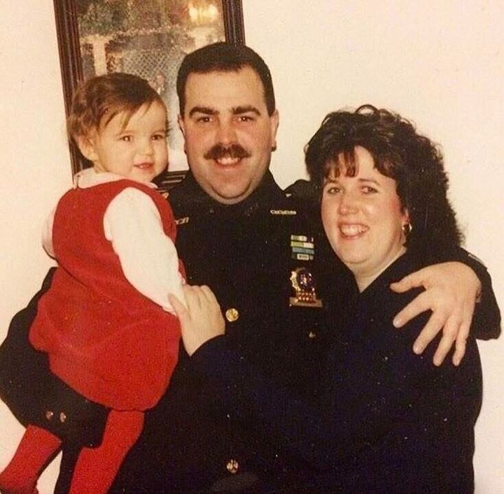 Emily Thomas with her dad and mom. This photo was taken after her father became a NYPD detective in 1998.