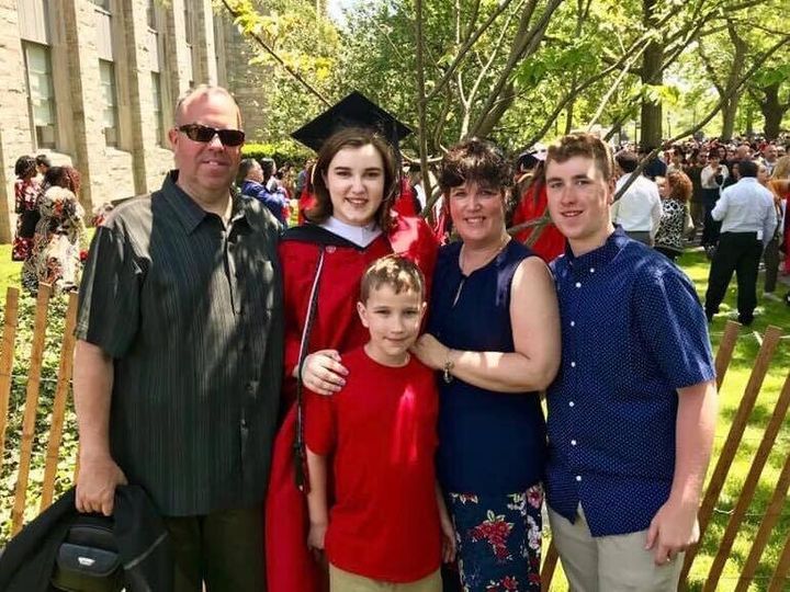 Thomas with her dad, mom and two brothers at her college graduation in May 2019.