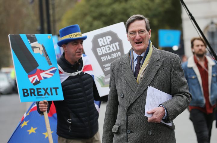 Former attorney general Dominic Grieve is confronted by an anti-Brexit protester