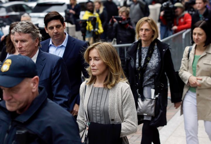 Felicity Huffman departs federal court in Boston, where she pleaded guilty to charges in a nationwide college admissions bribery scandal.