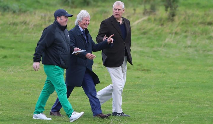 The Duke of York with solicitor Paul Tweed (centre) as he attends The Duke of York Young Champions Trophy at the Royal Portrush Golf Club in County Antrim