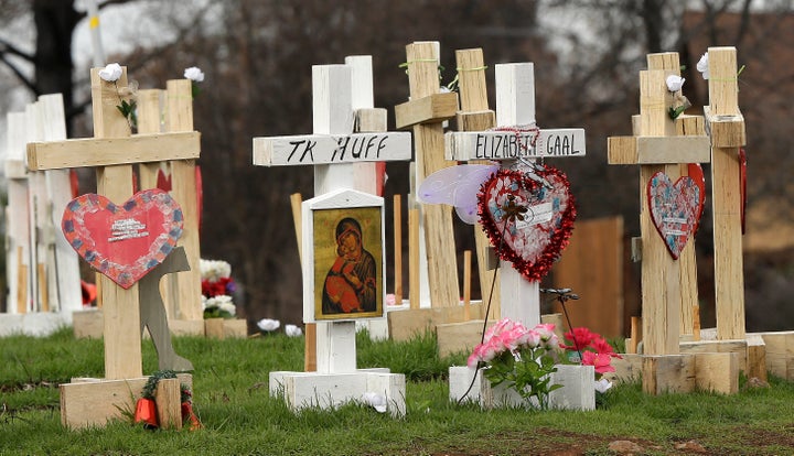 In this Thursday, Feb. 7, 2019, photo, the names of those who died in the Camp Fire are displayed on crosses that make up a m