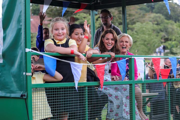 Kate smiles with guests as she visits the "Back To Nature" festival. 