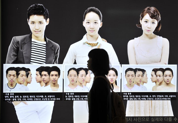 A street billboard advertises plastic surgery at a subway station in Seoul. South Korea's obsession with plastic surgery is moving on from standard eye and nose jobs to embrace a radical surgical procedure that requires months of often painful recovery.