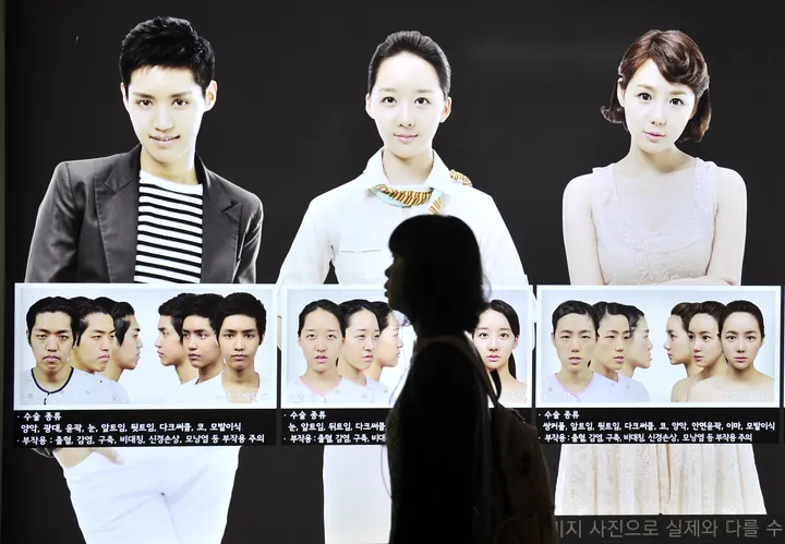A street billboard advertises plastic surgery at a subway station in Seoul. South Korea's obsession with plastic surgery is moving on from standard eye and nose jobs to embrace a radical surgical procedure that requires months of often painful recovery.