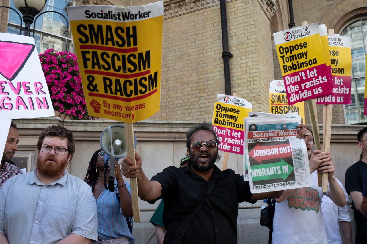 Demonstrators gather to oppose the Free Tommy Robinson demonstration, organised by anti-fascist groups including Stand up to Racism opposed to far right politics on 24th August 2019 in London, United Kingdom. Some 250 Stand Up To Racism and other anti-fascist groups took to the streets today in opposition to supporters of jailed Tommy Robinson real name Stephen Yaxley-Lennon at Oxford Circus, who gathered outside the BBC. (photo by Mike Kemp/In Pictures via Getty Images)