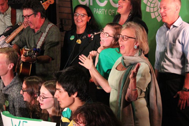 Green Party Leader Elizabeth May and supporters sing during a rally in Victoria Sept. 9.