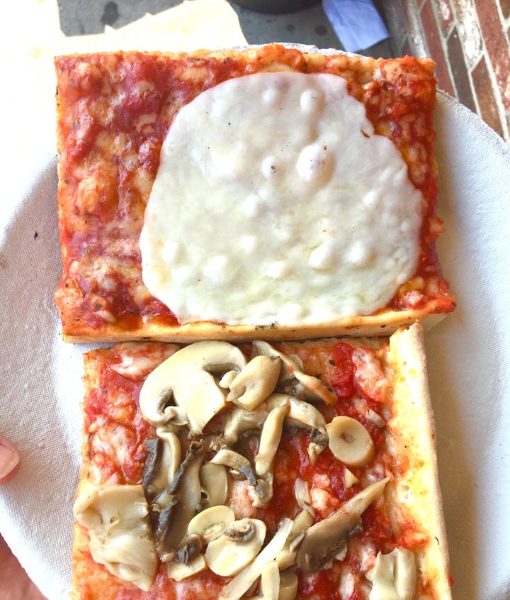 Provolone-draped slices of beach pizza from Cristy's in New Hampshire.