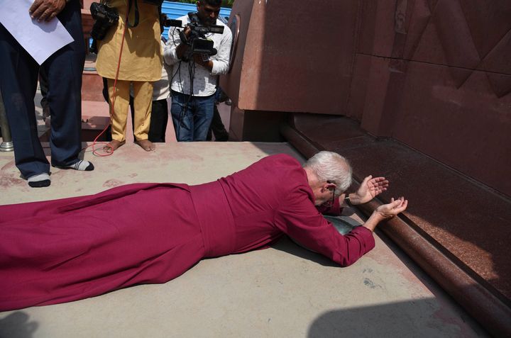The Archbishop of Canterbury Rev. Justin Welby, prostrates as he pays respect at the Jallianwala Bagh memorial in Amritsar.