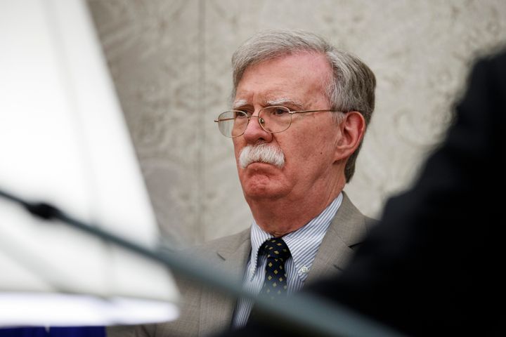 John Bolton listens as President Donald Trump speaks during a meeting with Romanian President Klaus Iohannis in the Oval Office of the White House, Tuesday, Aug. 20, 2019, in Washington. (AP Photo/Alex Brandon)