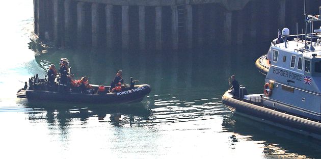 A group of people thought to be migrants are brought to the Port of Dover by Border Force officers after they were intercepted in the Channel in dinghies earlier this morning. (Photo by Gareth Fuller/PA Images via Getty Images)