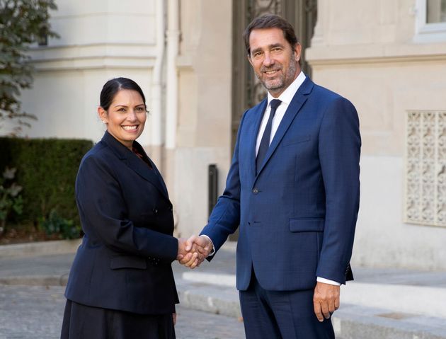 French Interior Minister Christophe Castaner, right, welcomes his British counterpart Priti Patel prior to a meeting at Interior Ministry in Paris, France, Thursday Aug. 29, 2019. (Zakaria Abdelkafi, Pool photo via AP)