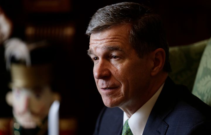 In this photo taken Wednesday, Dec. 19, 2018 North Carolina Gov. Roy Cooper listens during an interview at the Governor's mansion in Raleigh, N.C. (AP Photo/Gerry Broome)