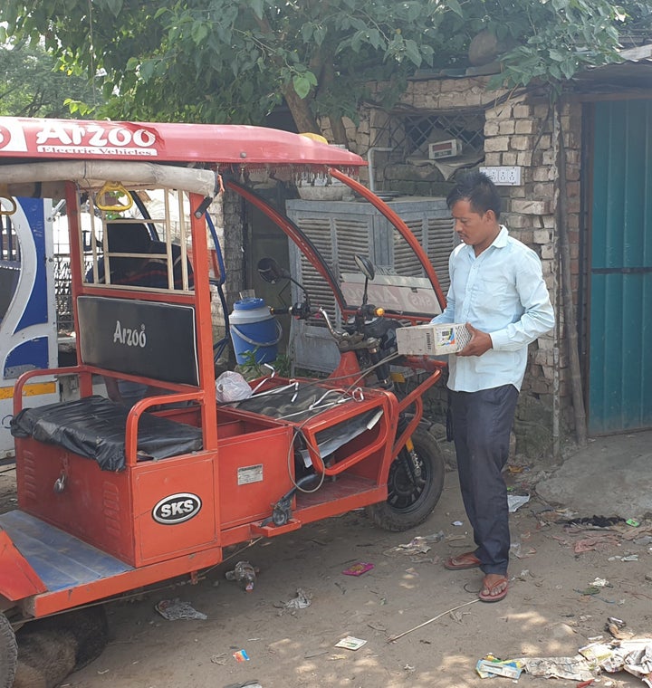 Baijnath is charging his e-rickshaw batteries at an unauthorised charging station at NAC Mani Majra in Chandigarh.