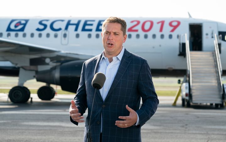 Conservative Leader Andrew Scheer talks with reporters prior to boarding his campaign plane in Ottawa on Sept. 11, 2019.