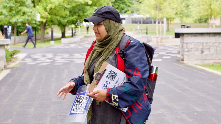 Sarah Hassanein talks to students at University of Toronto in Mississauga, Ont. on Sept. 4, 2019 about voting in the federal election.