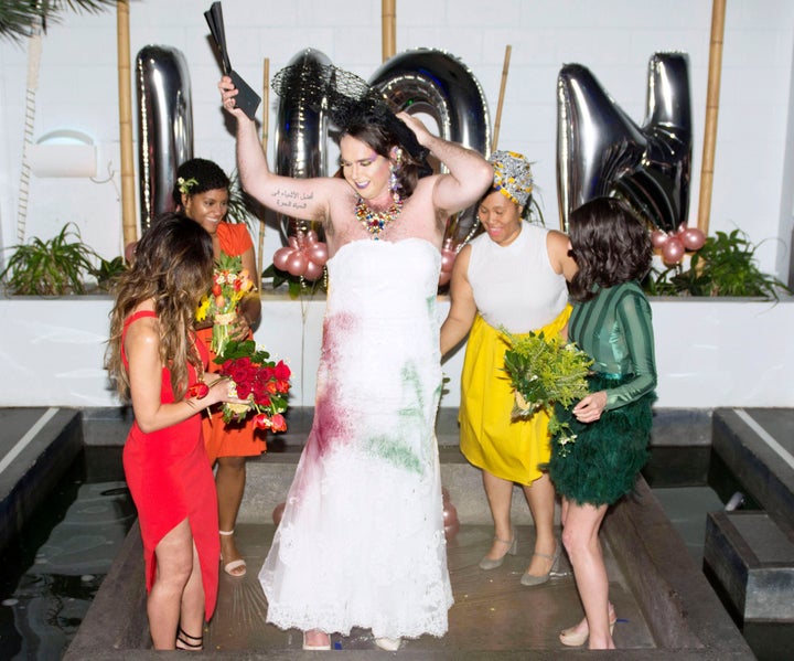 Inside each of the bridesmaids' bouquets were hidden spray-paint cans. Following the vows, the bridal party tore off Diane's black train and spray-painted their gown rainbow colors to symbolise Pride.