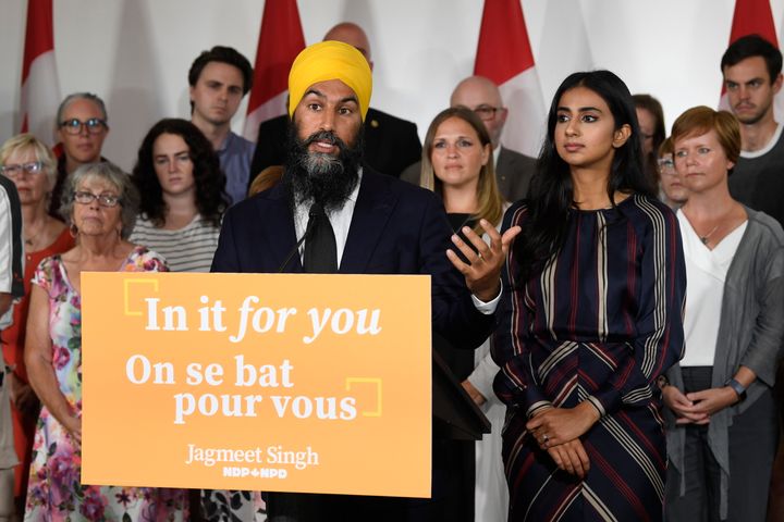 NDP Leader Jagmeet Singh answers questions as his wife Gurkiran Kaur Sidhu looks on at his campaign launch in London, Ont. on Sept.11, 2019.