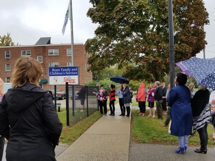 Workers stand outside a Brant Family and Children's Services building in a 2018 Facebook photo.
