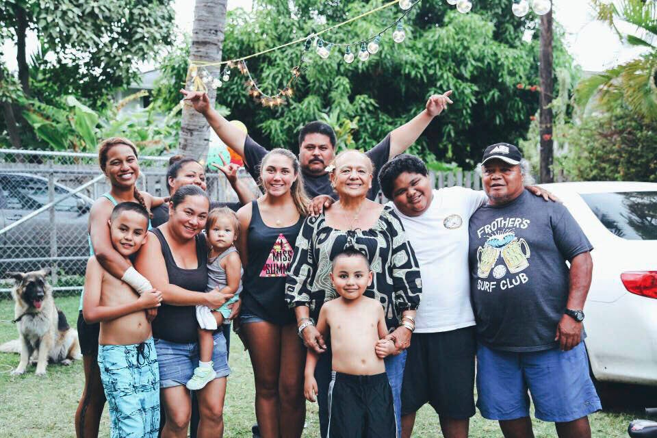 An old photograph of the Manuwai family in the yard of their Kailua home.