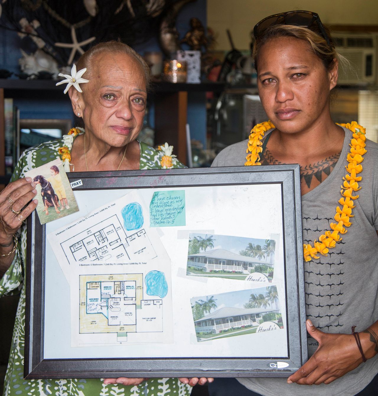 Joddy ʻIwalani Manuwai and her daughter Kaʻiulani Manuwai hold the blueprints for what their home was supposed to look like after renovations.