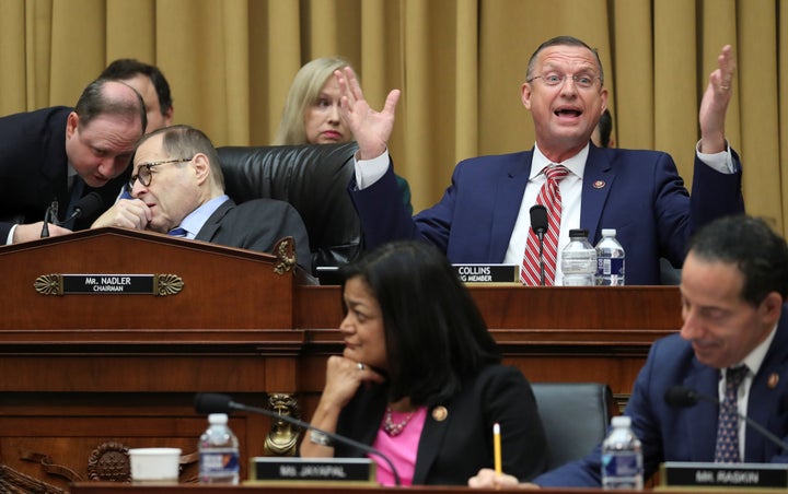 House Judiciary Committee ranking member Rep. Doug Collins (R-Ga.) speaks Thursday as Chairman Jerry Nadler (D-N.Y.) speaks with an aide during markup on a resolution on procedures “for future hearings related to its investigation to determine whether to recommend articles of impeachment with respect to U.S. President Donald Trump.”