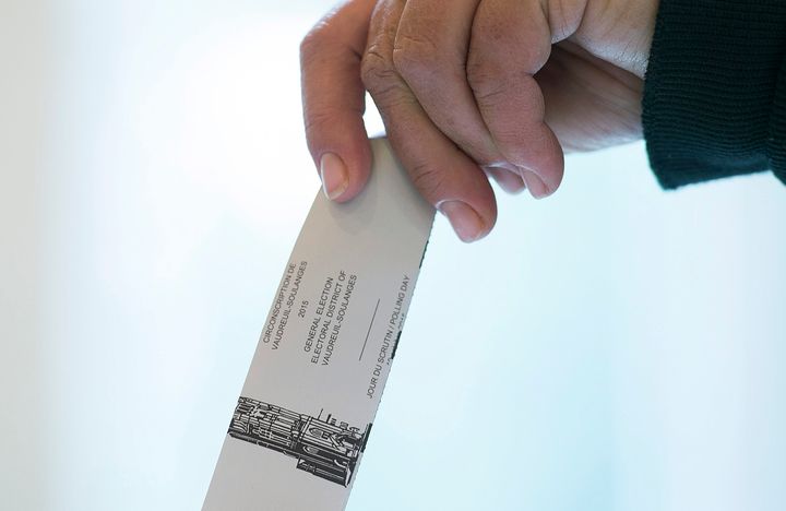 File photo of a voter casting a ballot in the riding of Vaudreuil-Soulanges, west of Montreal, on election day on Oct. 19, 2015. 