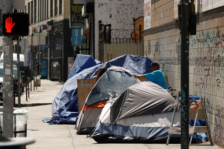 Tents and tarps erected by homeless people are shown along sidewalks and streets in the skid row area of downtown Los Angeles.