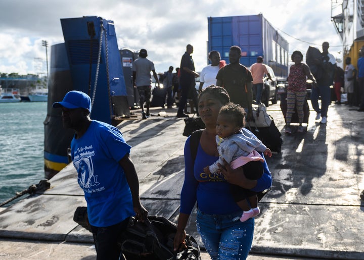 Evacuees get off a ferry after leaving Marsh Harbour on Abaco Island in the aftermath of hurricane Dorian on Sept. 9. President Donald Trump said Monday that the U.S. would have to be careful about allowing Bahamian survivors into the country.