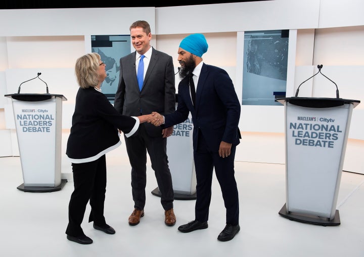 Green Party Leader Elizabeth May, left, Conservative Leader Andrew Scheer, centre, and NDP Leader Jagmeet Singh shake hands during the Maclean's/Citytv National Leaders Debate in Toronto on Sept. 12, 2019. 