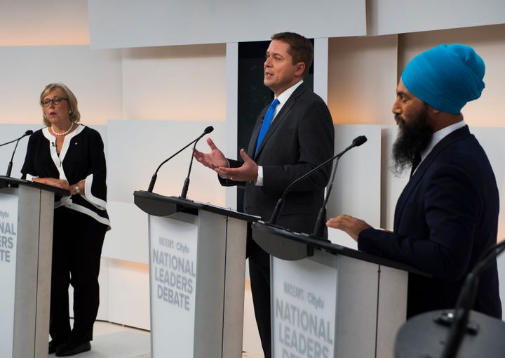 Conservative Leader Andrew Scheer, centre, speaks as Green Party Leader Elizabeth May and NDP Leader Jagmeet Singh listen during the Maclean's/Citytv National Leaders Debate in Toronto on Sept. 12, 2019. 